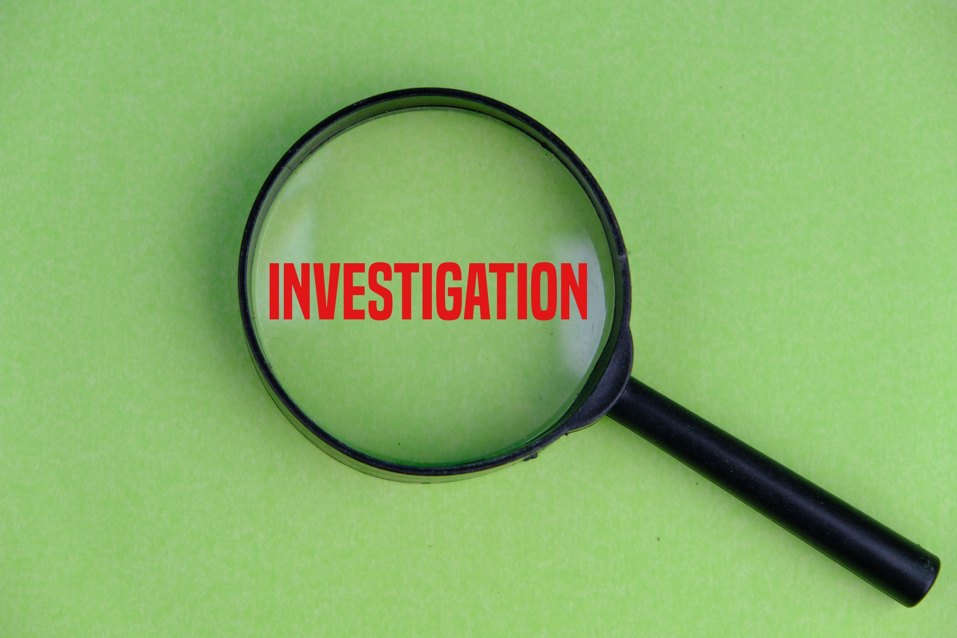 magnifying glass with text of Investigation